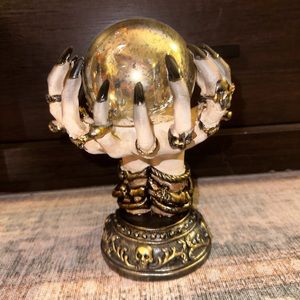 Witch decor holding magic ball
